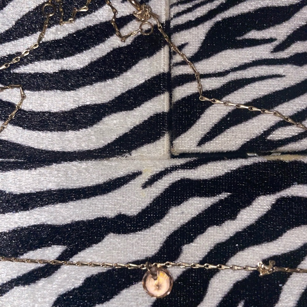 Gold chain necklace with light pink color stone